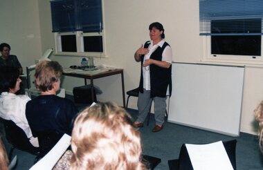 Photograph, Lady giving a talk at Park Orchards Community Centre