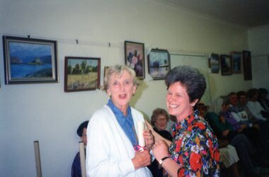 Photograph, One lady presenting a certificate to another lady at Park Orchards Community Centre