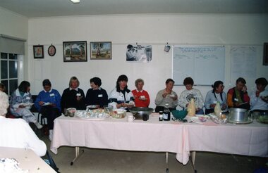 Photograph, Thirteen ladies, with name tags, eating at Park Orchards Community Centre