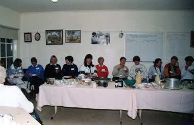 Photograph, Thirteen ladies, with name tags, eating at Park Orchards Community Centre