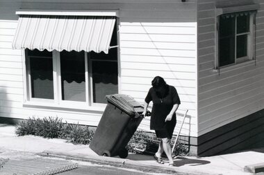 Photograph, Putting out the bin at Park Orchards Community Centre, Unknown date
