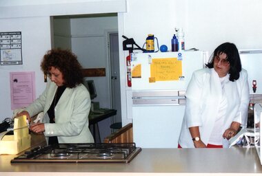 Photograph, Two ladies in Park Orchards Community Centre's kitchen, Unknown year