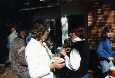 Photograph, Group of people enjoying company outside at Park Orchards Community Centre, Unknown date