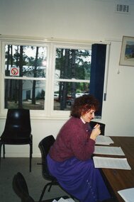 Photograph, Lady writing at Park Orchards Community House, Unknown date