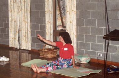 Photograph, Instructor stretching at Park Orchards Community House, Unknown date