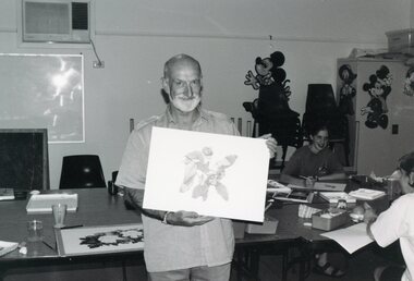Photograph, Artist showing his drawing at Park Orchards Community House, Unknown date