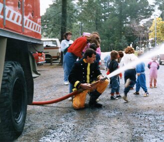 Photograph, Playgroup at Park Orchards Community Centre with South Warrandyte CFA hosing, Unknown date