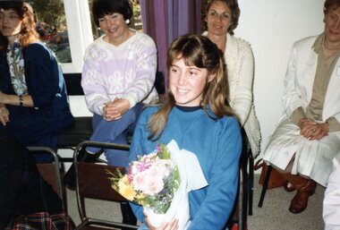 Photograph, Child-care coordinator Jacqui Bourchier presented with flowers at Park Orchards Community Centre, Unknown date