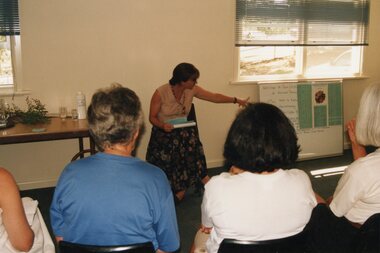 Photograph, Lady giving a talk at Park Orchards Community Centre, Unknown date