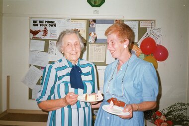 Photograph, Older lady and another eating cake at Park Orchards Community House, Unknown date