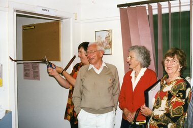 Photograph, Lady cutting ribbon for Room 3 at Park Orchards Community House, 26th June 1997