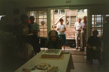 Photograph, Vima blowing out candles on her 100th birthday cake at Park Orchards Community House, Circa 2004