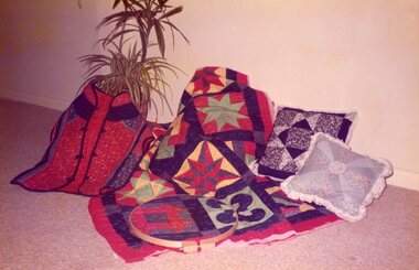 Photograph, Display of patchwork from the class at POCH, Date unknown