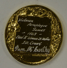 Gold medal, Gold medal from 1963 Victorian Paraplegic Games - Class B Women's 25 metres - 1st Crawl - Pam McCarthy, 1963
