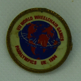 Lapel badge, VII World Wheelchair Games - Paralympics UK 1984 badge