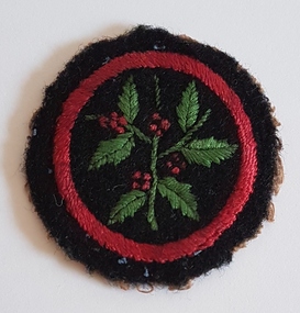 Round Girl Guide badge.