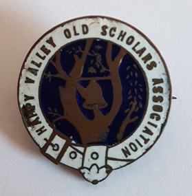 Enameled blue and white badge with gold bell and tree in centre. 