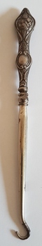 Silver button hook. Used for doing up boots with buttons.