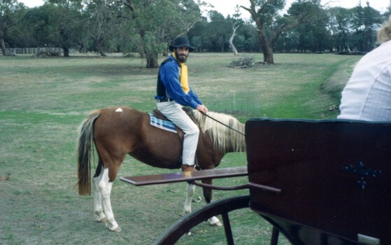 Man riding a horse.