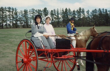 Three people in period costume.