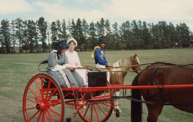 Three people in period costume.