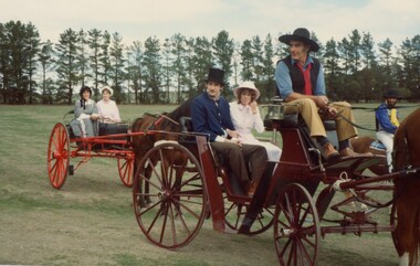 People in horsedrawn carriages.