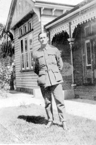 Man standing in front of a house.