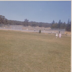 People playing tennis.