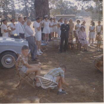 People at opening of tennis courts.