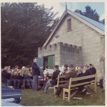 Brass band playing outside a church.