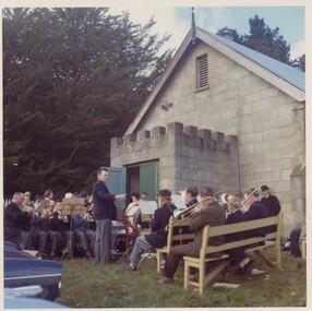 Brass band playing outside a church.