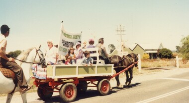 Horse and cart in a parade.