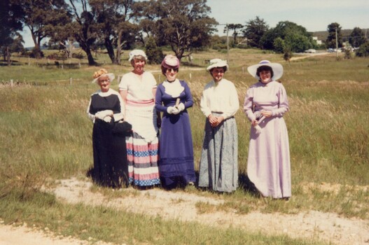 Five women in period costume.