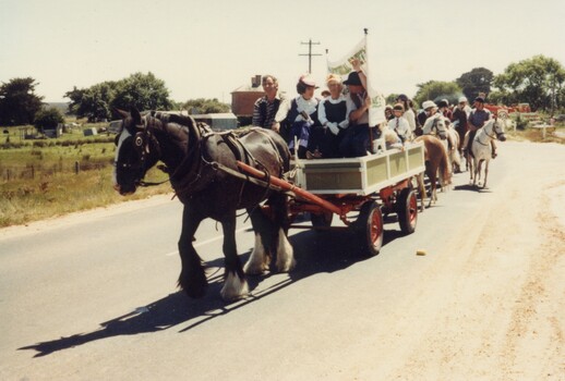 Horse and cart in parade.