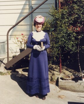 Woman dressed in period costume.