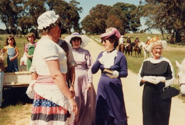 Women in period costume.