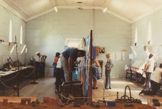 People setting up an exhibition.