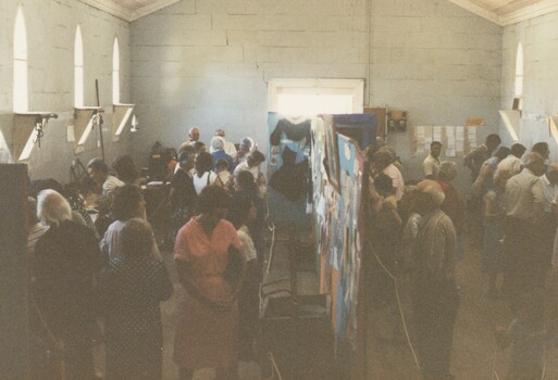 Crowd of people at an exhibition.