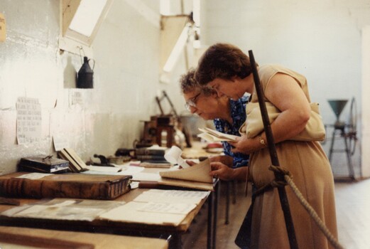 Two women at an exhibition.