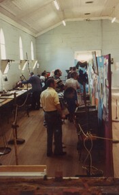 Crowd of people at an exhibition.