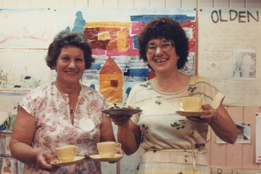 Two women at an exhibition.