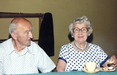 Two people at an exhibition.