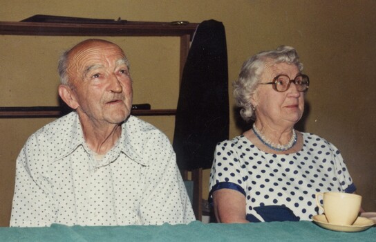 Two people at an exhibition.