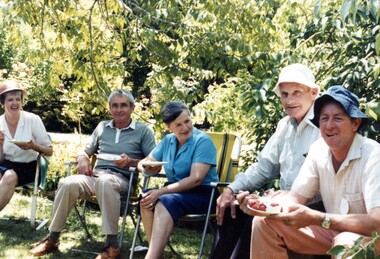 People having afternoon tea at an exhibition.