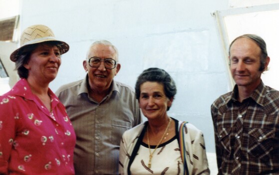 Four people at an exhibition.