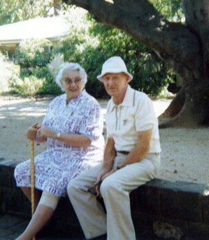 Elderly couple at the zoo.