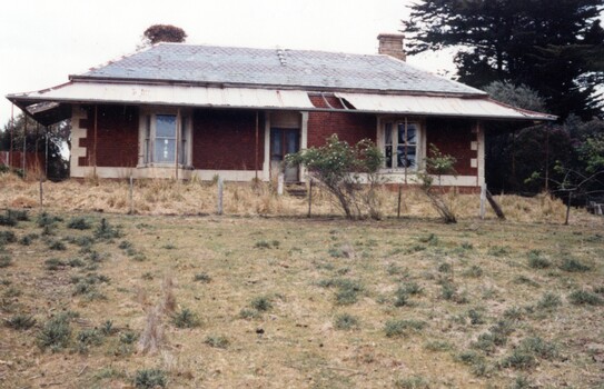 Dilapidated brick homestead.