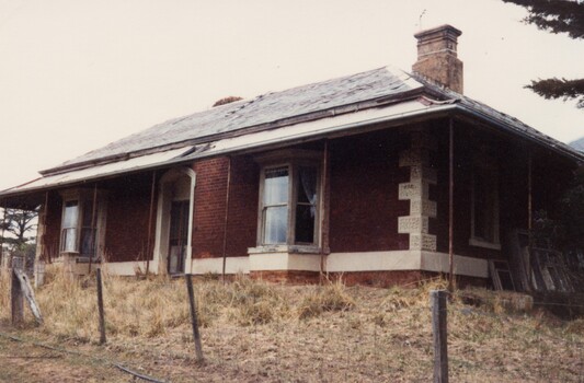 Dilapidated brick homestead.