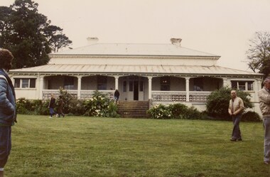 People at an old homestead.