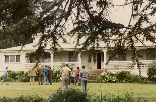 People at an old homestead.